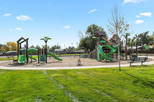 view of jungle gym featuring a lawn