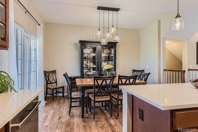 dining area featuring light wood-type flooring