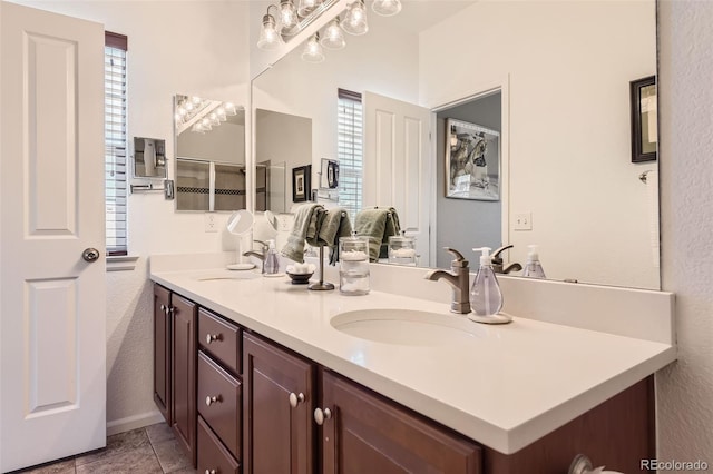 bathroom featuring tile patterned flooring and vanity