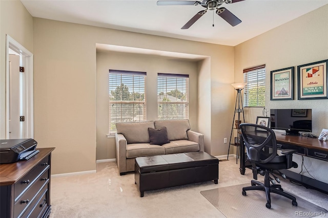 carpeted office with ceiling fan