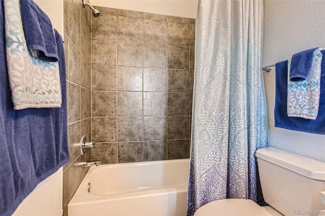 bathroom with toilet and shower / bath combo