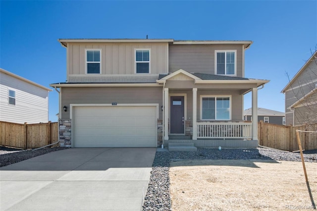 view of front of house featuring a porch and a garage