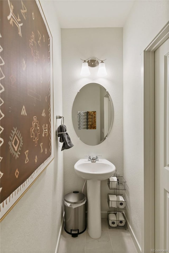 bathroom with tile patterned floors