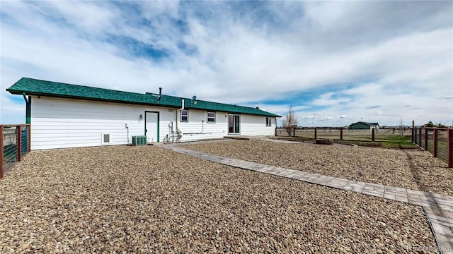 32350 E 137th Way, Brighton, CO 80603 - view of front of house featuring central AC and a fenced backyard