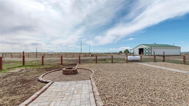 32350 E 137th Way, Brighton, CO 80603 - view of yard with fence, an outdoor structure, a view of countryside, and a fire pit