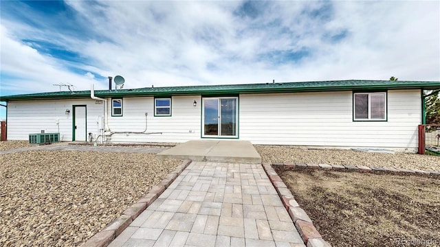 32350 E 137th Way, Brighton, CO 80603 - back of property with a patio area and central AC unit