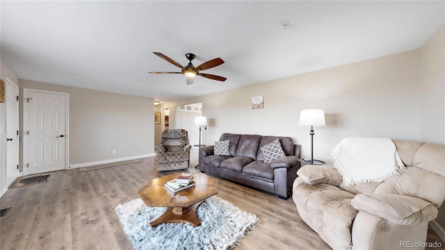 32350 E 137th Way, Brighton, CO 80603 - living area featuring ceiling fan, wood finished floors, and baseboards