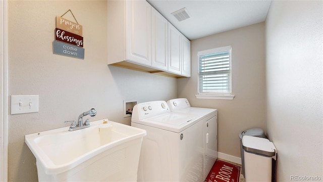 32350 E 137th Way, Brighton, CO 80603 - laundry room with cabinet space, washer and clothes dryer, and baseboards