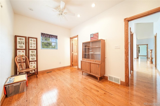 sitting room with ceiling fan and light hardwood / wood-style floors