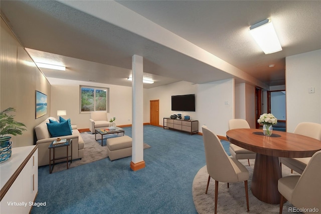 carpeted dining area with a textured ceiling