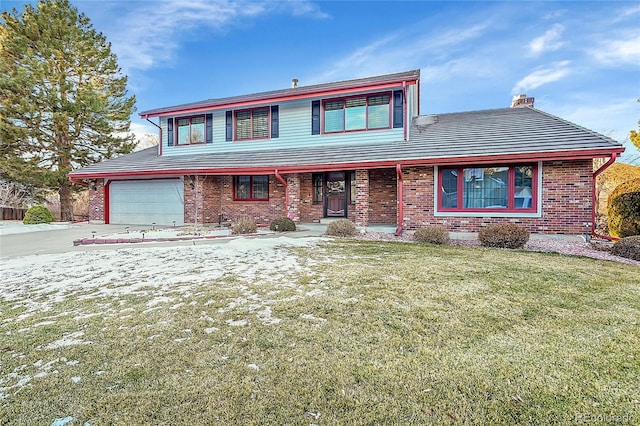 front of property featuring a garage and a front lawn