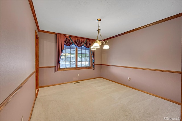 carpeted empty room with crown molding and a notable chandelier