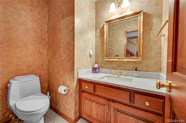 bathroom with tile patterned floors, vanity, and toilet