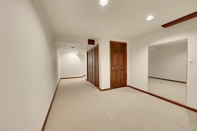 empty room featuring light colored carpet