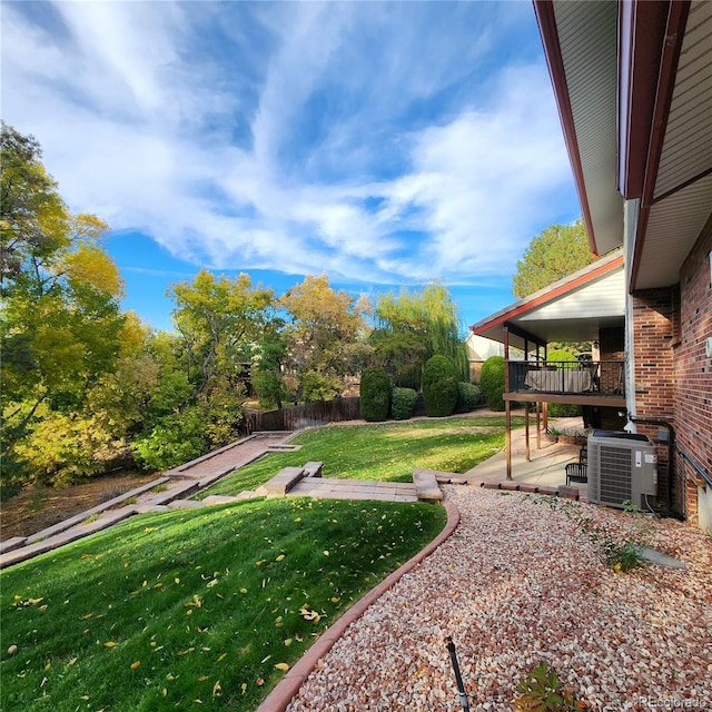 view of yard featuring a patio and central air condition unit