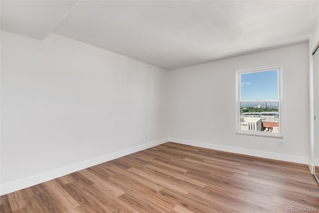 2 Adams St Unit 1504, Denver, CO 80206 - empty room featuring light wood-style floors and baseboards