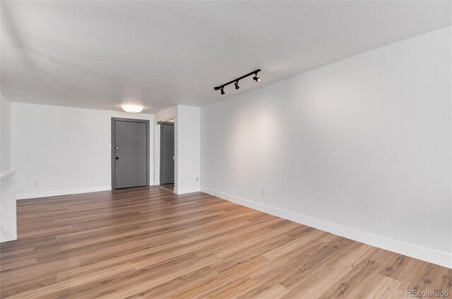 2 Adams St Unit 1504, Denver, CO 80206 - unfurnished room with track lighting and light wood finished floors