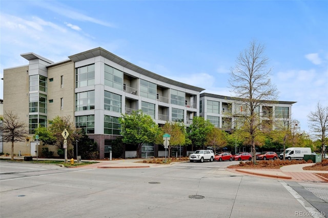 view of property featuring uncovered parking
