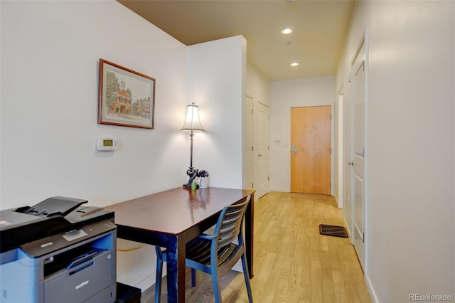 home office with light wood-style floors and recessed lighting