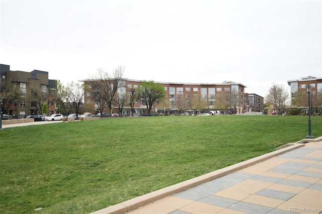 view of home's community featuring a lawn