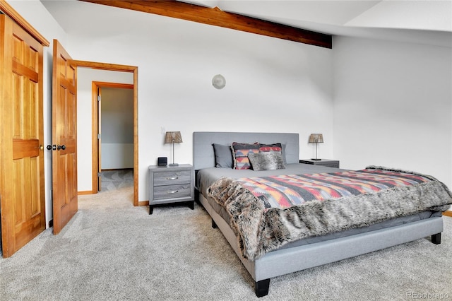 bedroom with baseboards, carpet, and vaulted ceiling with beams