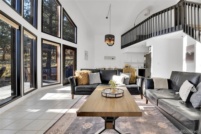 living room featuring light tile patterned floors and a high ceiling