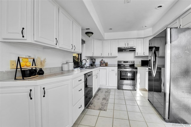 kitchen featuring under cabinet range hood, white cabinets, stainless steel appliances, and a sink