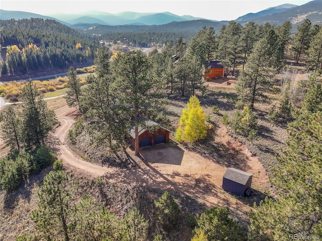 drone / aerial view with a view of trees and a mountain view