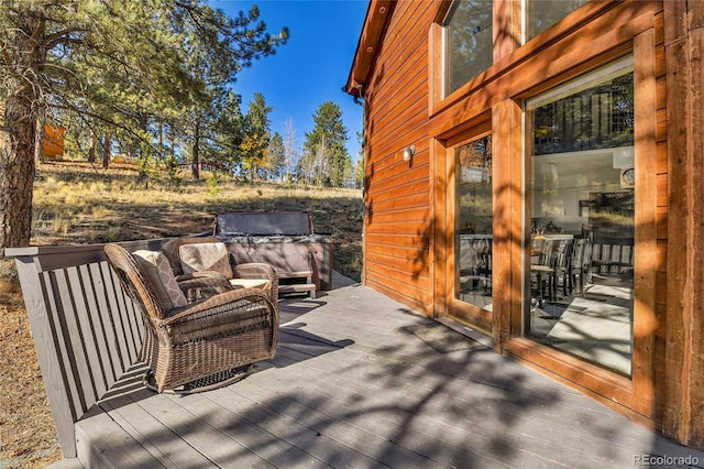 wooden terrace with outdoor lounge area