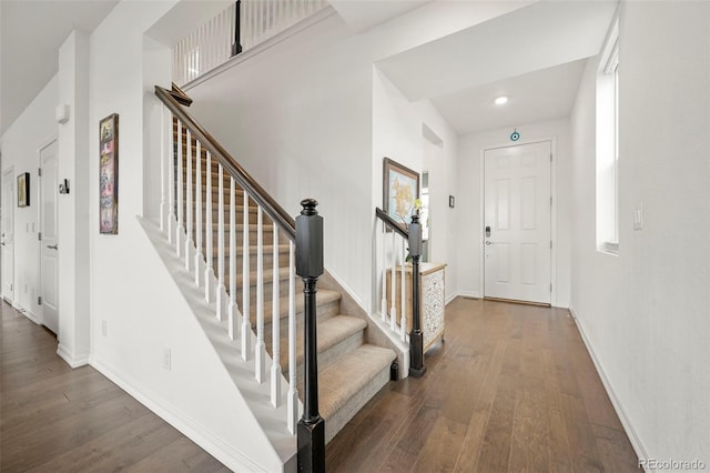 13108 Stoney Meadows Way, Peyton, CO 80831 - entrance foyer with dark wood-type flooring, stairs, and healthy amount of natural light