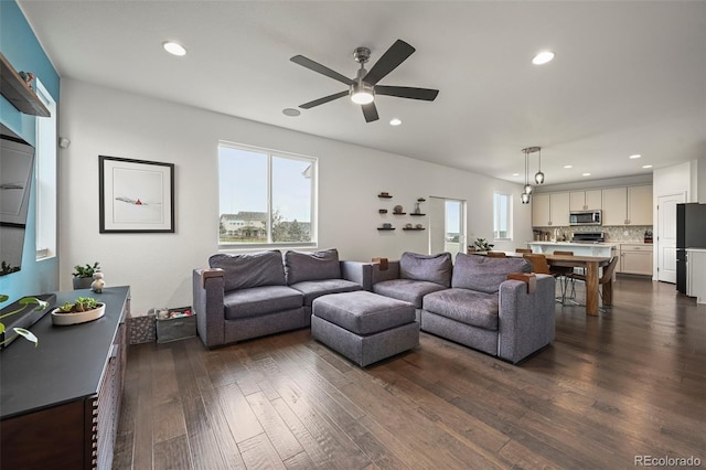 13108 Stoney Meadows Way, Peyton, CO 80831 - living room featuring a ceiling fan, recessed lighting, and dark wood-style flooring
