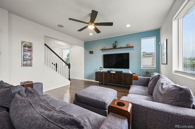 13108 Stoney Meadows Way, Peyton, CO 80831 - living area with wood finished floors, healthy amount of natural light, stairway, recessed lighting, and a ceiling fan
