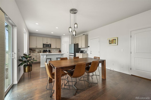 13108 Stoney Meadows Way, Peyton, CO 80831 - dining space featuring dark wood-style flooring and recessed lighting
