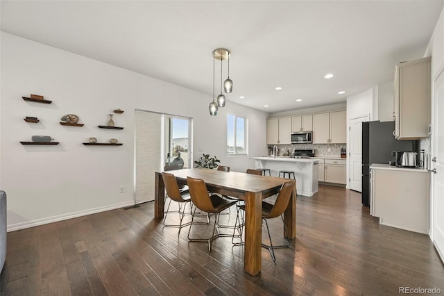 13108 Stoney Meadows Way, Peyton, CO 80831 - dining room with dark wood-style flooring and recessed lighting