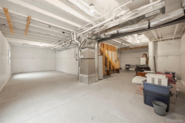 13108 Stoney Meadows Way, Peyton, CO 80831 - unfinished basement with gas water heater, stairs, and heating unit