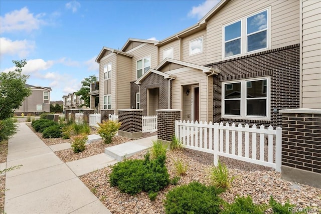 15492 W 65th Ave Unit C, Arvada, CO 80007 - view of front of property featuring brick siding and a residential view