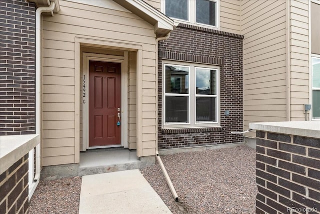 15492 W 65th Ave Unit C, Arvada, CO 80007 - property entrance featuring brick siding