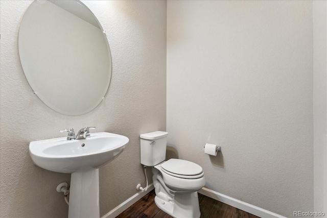 15492 W 65th Ave Unit C, Arvada, CO 80007 - half bathroom with wood finished floors and baseboards