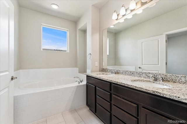 15492 W 65th Ave Unit C, Arvada, CO 80007 - bathroom featuring a bath, double vanity, and tile patterned floors