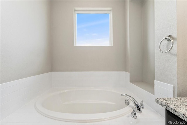 15492 W 65th Ave Unit C, Arvada, CO 80007 - bathroom featuring a garden tub and vanity