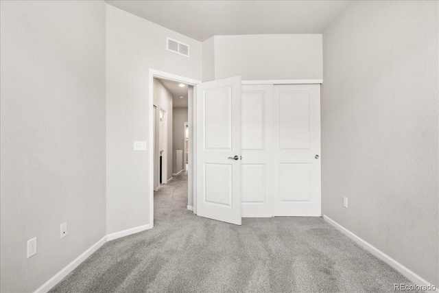 15492 W 65th Ave Unit C, Arvada, CO 80007 - unfurnished bedroom featuring carpet floors and baseboards