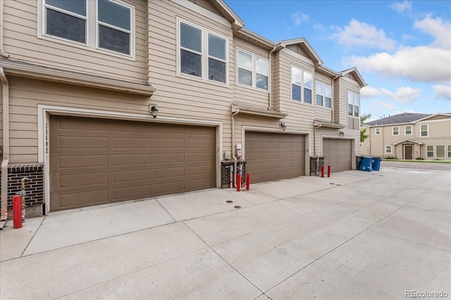 15492 W 65th Ave Unit C, Arvada, CO 80007 - view of front facade with an attached garage and concrete driveway