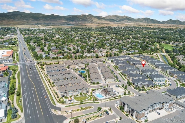 15492 W 65th Ave Unit C, Arvada, CO 80007 - aerial view of property and surrounding area with a mountainous background and nearby suburban area