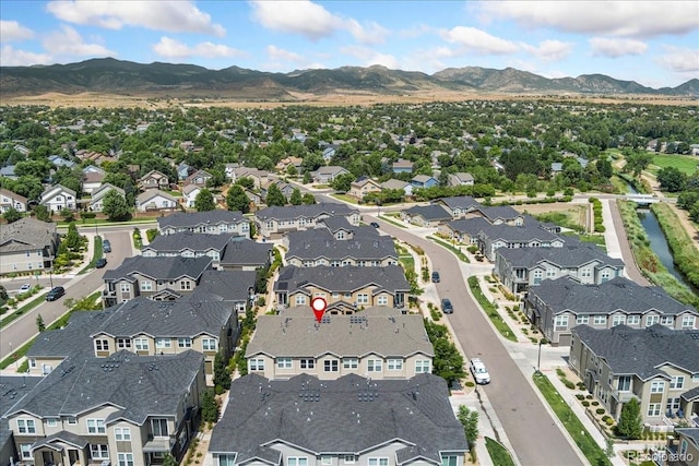 15492 W 65th Ave Unit C, Arvada, CO 80007 - aerial overview of property's location with a mountainous background and nearby suburban area