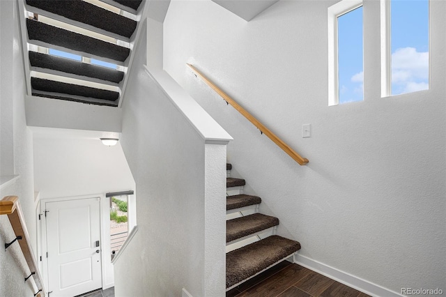 19096 E 55th Ave, Denver, CO 80249 - staircase with wood finished floors and baseboards