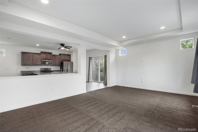 19096 E 55th Ave, Denver, CO 80249 - unfurnished living room featuring recessed lighting, dark colored carpet, healthy amount of natural light, baseboards, and a ceiling fan