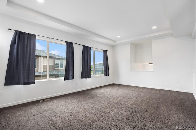 19096 E 55th Ave, Denver, CO 80249 - empty room featuring recessed lighting, a tray ceiling, baseboards, and dark colored carpet