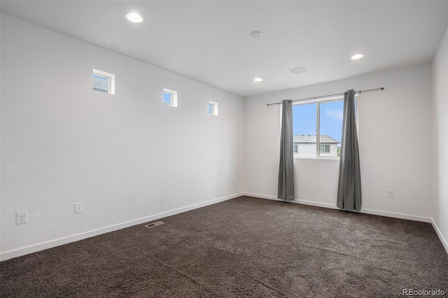 19096 E 55th Ave, Denver, CO 80249 - empty room featuring recessed lighting, baseboards, and dark carpet