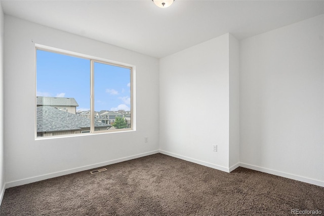 19096 E 55th Ave, Denver, CO 80249 - spare room featuring carpet floors and baseboards