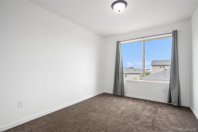 19096 E 55th Ave, Denver, CO 80249 - carpeted empty room with baseboards